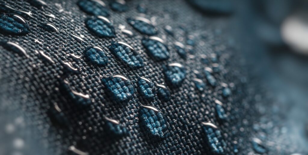 Close-up view on water drops on waterproof impregnated fabric