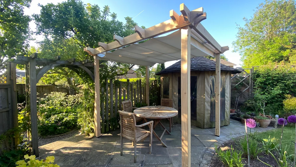 Traditional pergola with retractable waterproof shade closed