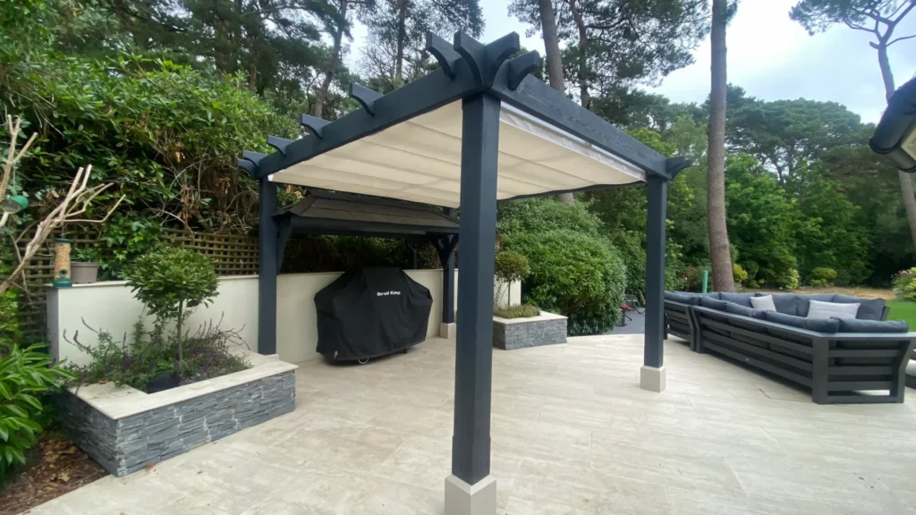 Traditional pergola with retractable waterproof shade closed with BBQ