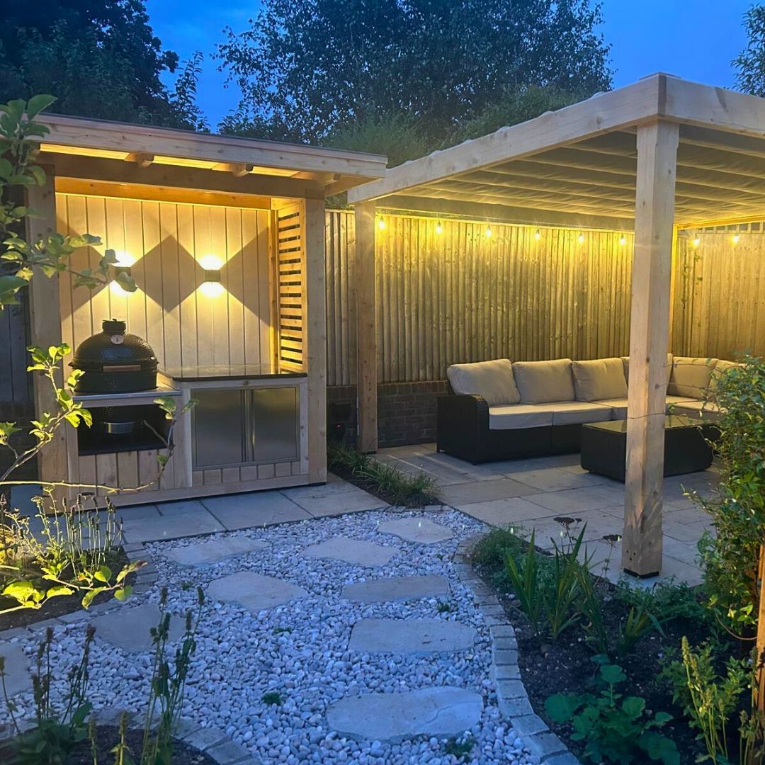 Bespoke modern and outdoor kitchen with waterproof retractable shade at night